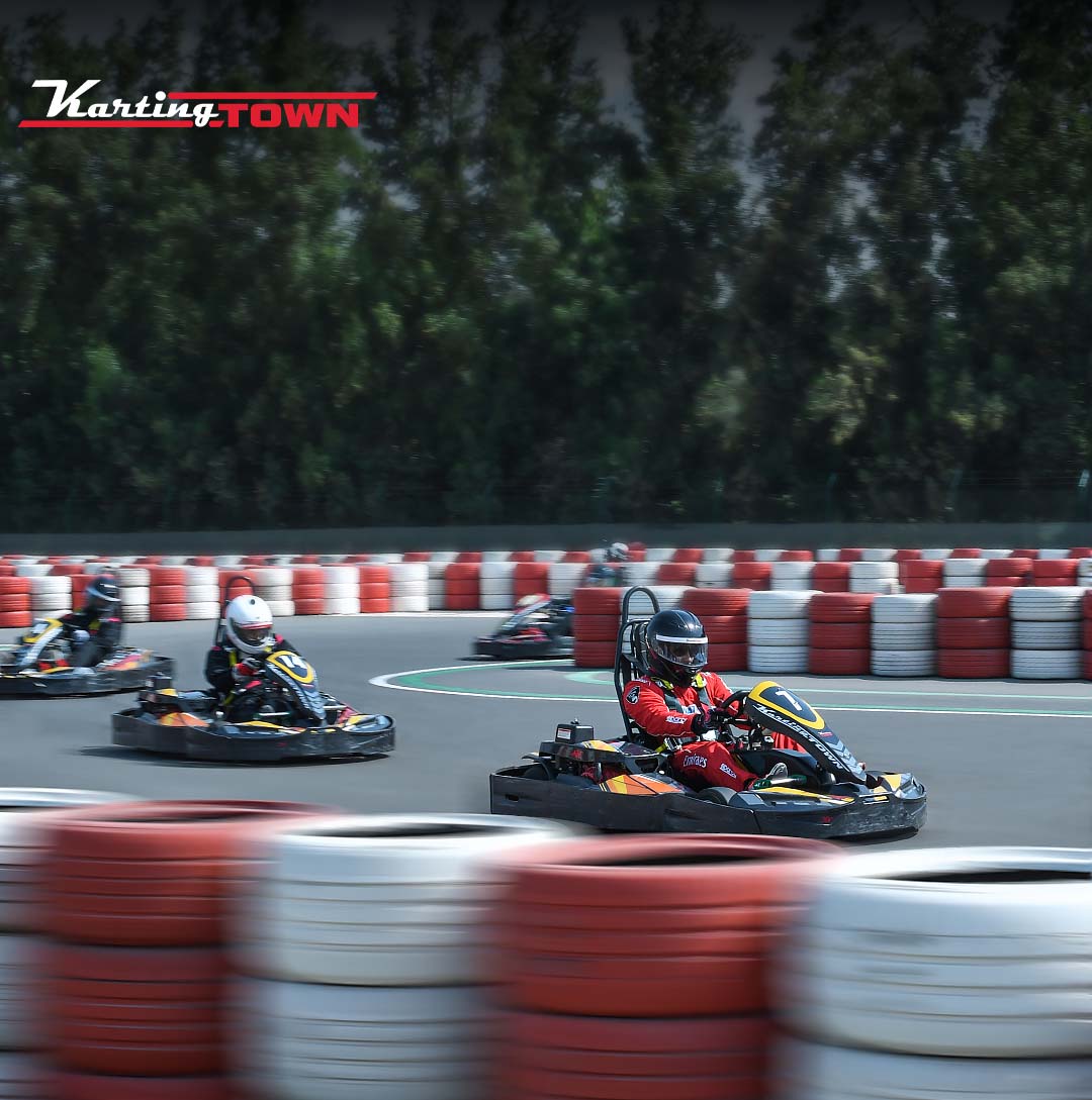 A traditional wooden boat carrying passengers on calm blue waters under a clear sky in Musandam 