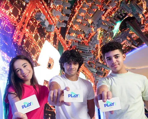 A traditional wooden boat carrying passengers on calm blue waters under a clear sky in Musandam 