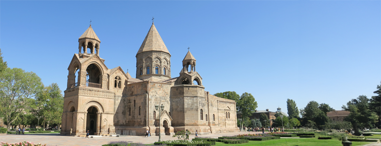 A traditional wooden boat carrying passengers on calm blue waters under a clear sky in Musandam 